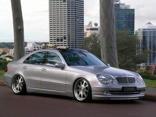 Here are a couple pics of a W211 with similar rims knockoffs but still