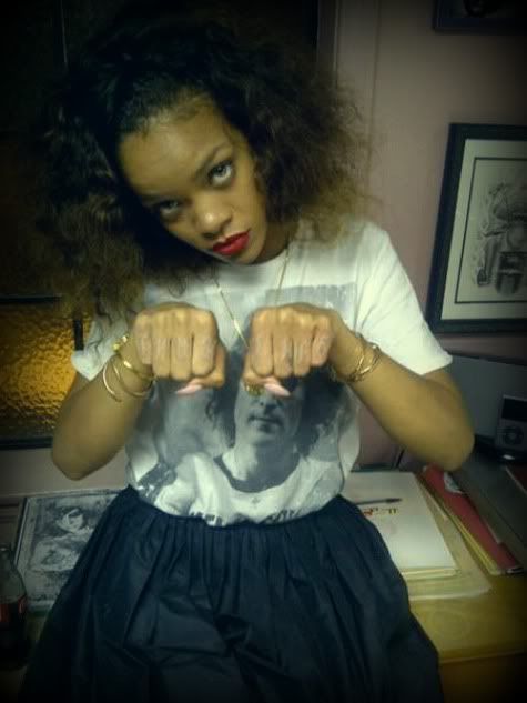 Rihanna flashed her new Thug Life knuckle tattoos like a real G while she