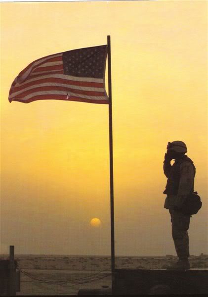 Soldier salutes Flag