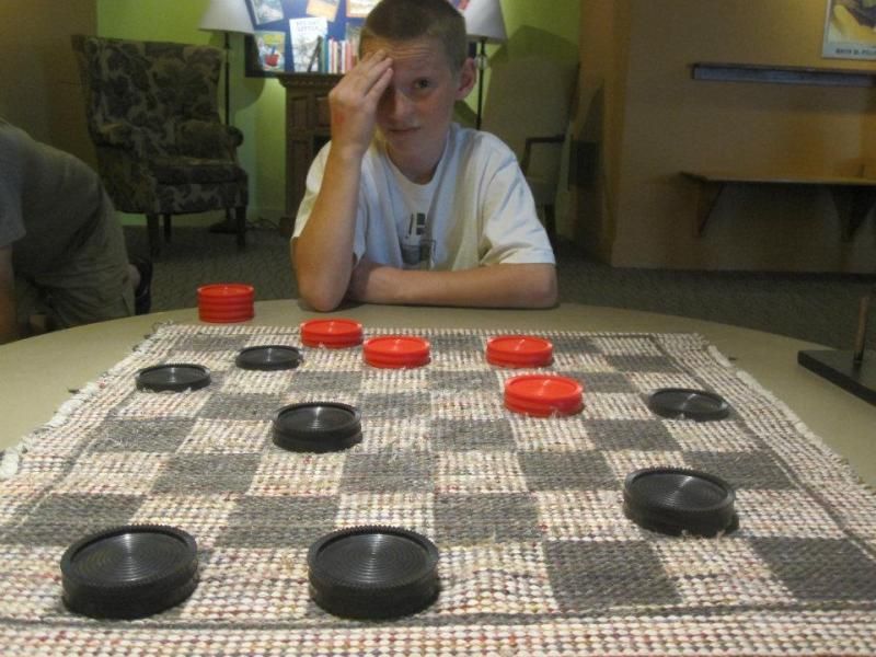 Ryan trying to figure out how he is going to beat me at checkers.  (He did by the way and I don't let kids win.)