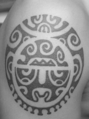 The shoulder tattoo is based on a Polynesian tattoo