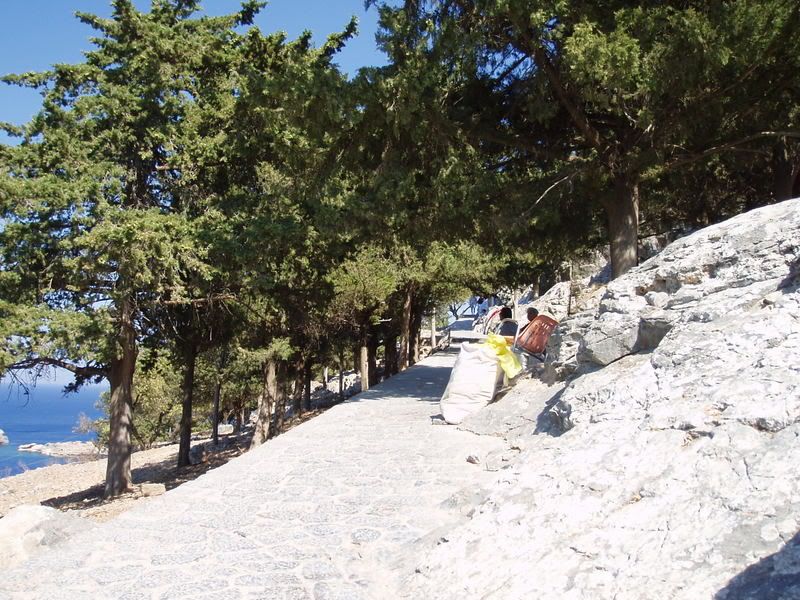 P1010077.jpg As we approached the top of the steps around the mountain we came across two older Greek ladies sat in the shade selling many pieces of fabric and lace.  It was an amusing sight because were very tired from all the walking up the mountain but then we image by fenderboy19